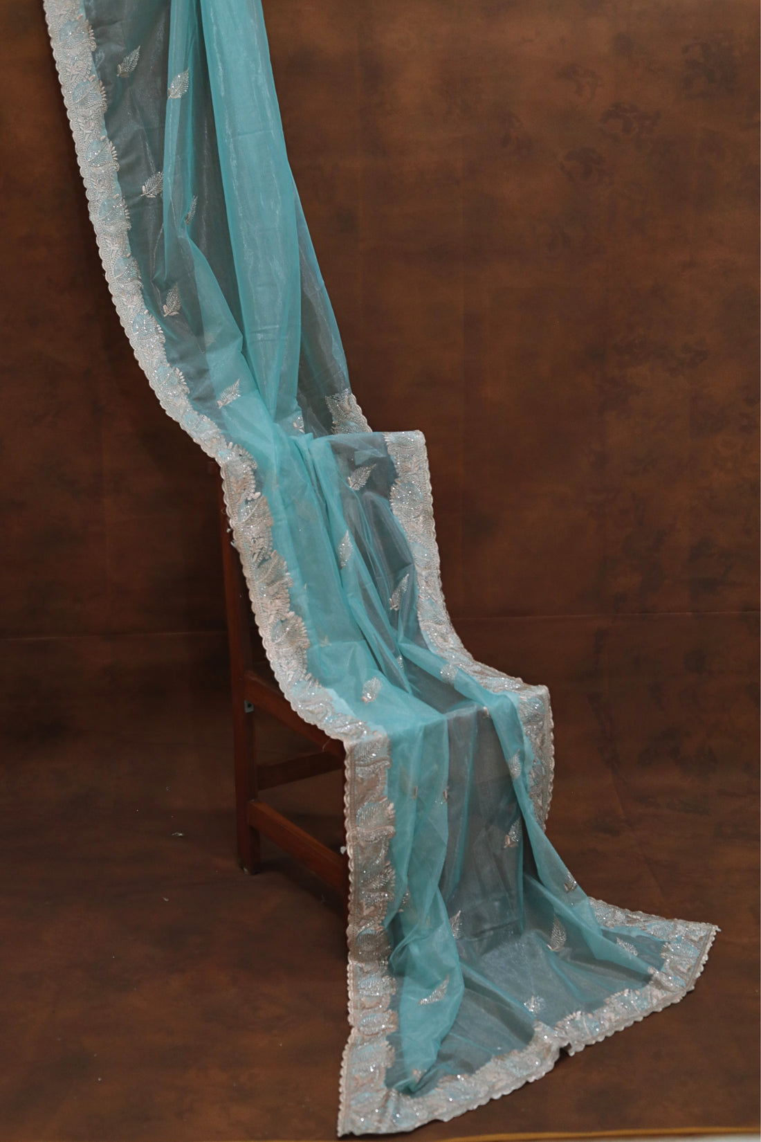 ISHNA  Sky Blue Organza Tissue Saree with Stone leaf Border